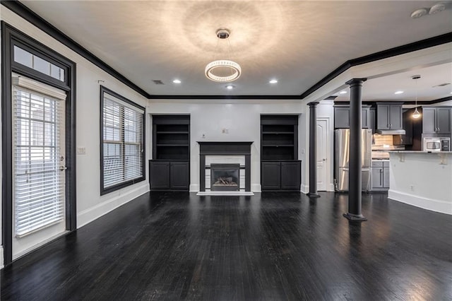 2767 Durham Dr NE, Atlanta, GA 30319 - unfurnished living room featuring ornate columns, ornamental molding, wood finished floors, baseboards, and a glass covered fireplace