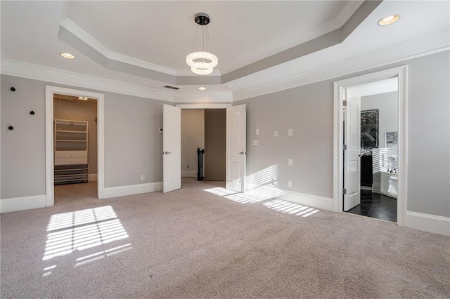 2767 Durham Dr NE, Atlanta, GA 30319 - unfurnished bedroom with crown molding, a raised ceiling, light colored carpet, recessed lighting, and baseboards