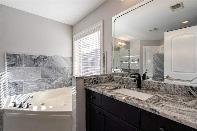 2767 Durham Dr NE, Atlanta, GA 30319 - bathroom with a whirlpool tub and vanity