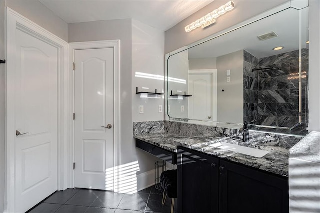2767 Durham Dr NE, Atlanta, GA 30319 - bathroom featuring vanity, tile patterned flooring, and a tile shower
