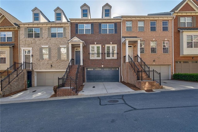 2767 Durham Dr NE, Atlanta, GA 30319 - multi unit property with an attached garage, brick siding, and concrete driveway