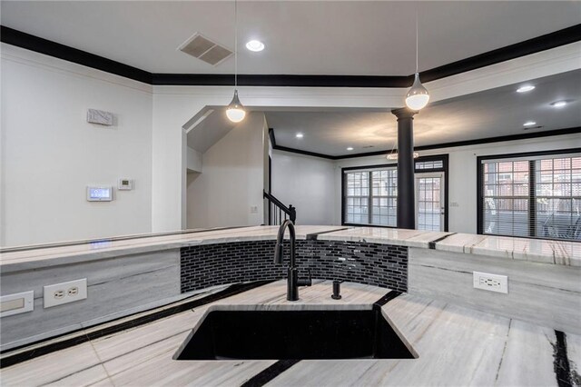 2767 Durham Dr NE, Atlanta, GA 30319 - bathroom featuring ornamental molding, a sink, ornate columns, plenty of natural light, and recessed lighting