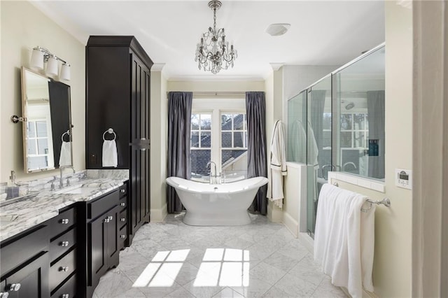 bathroom with crown molding, separate shower and tub, vanity, and a chandelier