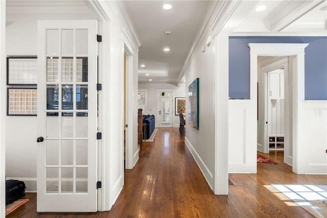 hallway featuring crown molding and dark wood-type flooring