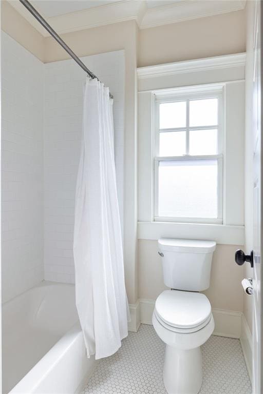 bathroom with shower / bathtub combination with curtain, tile patterned floors, and toilet