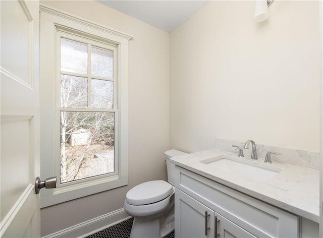 bathroom featuring vanity and toilet