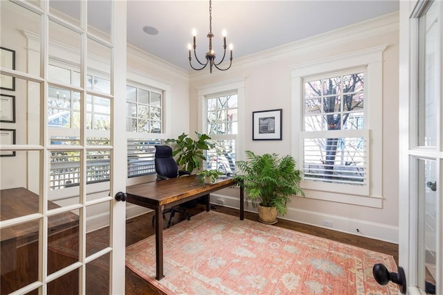 office with ornamental molding, wood-type flooring, a chandelier, and french doors