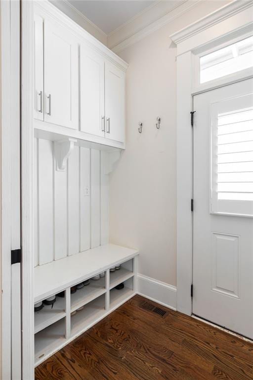 mudroom with crown molding and dark hardwood / wood-style floors