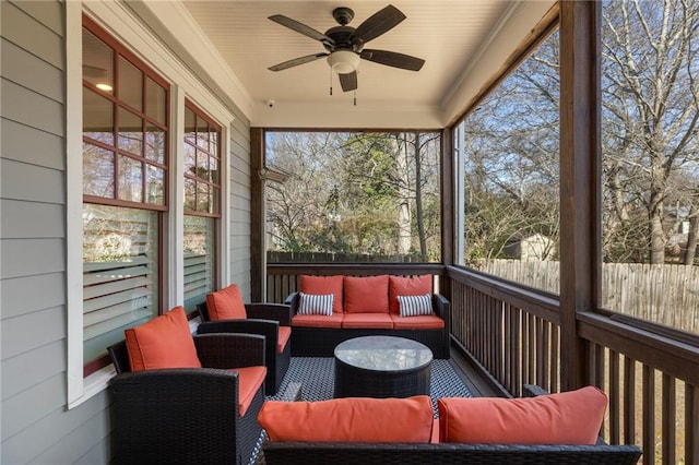 sunroom featuring ceiling fan