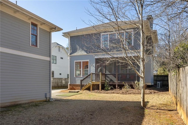 back of house featuring a deck