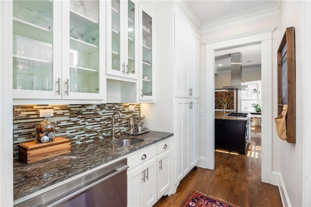 bar with island range hood, sink, white cabinets, dark stone counters, and stainless steel dishwasher