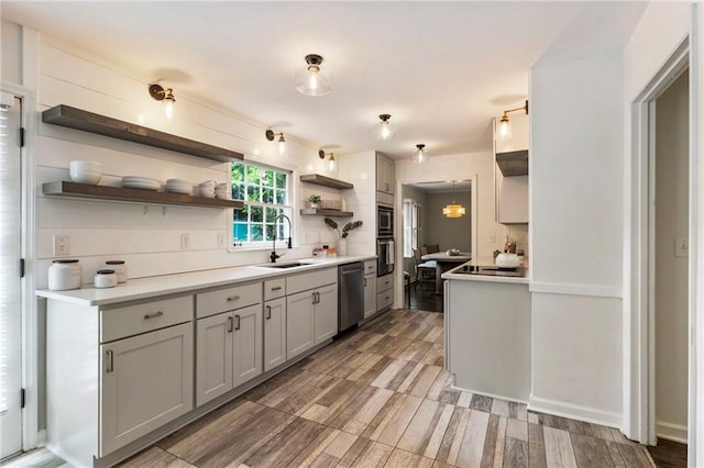 kitchen with a sink, open shelves, dishwasher, built in microwave, and light countertops