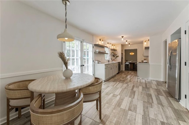 dining area with light wood-type flooring