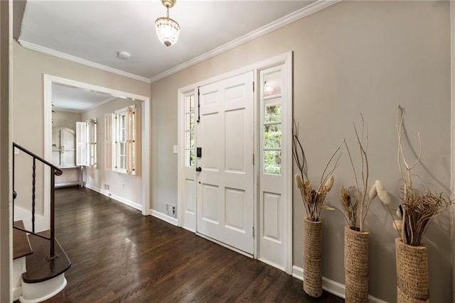 entryway with wood finished floors, baseboards, crown molding, and stairway