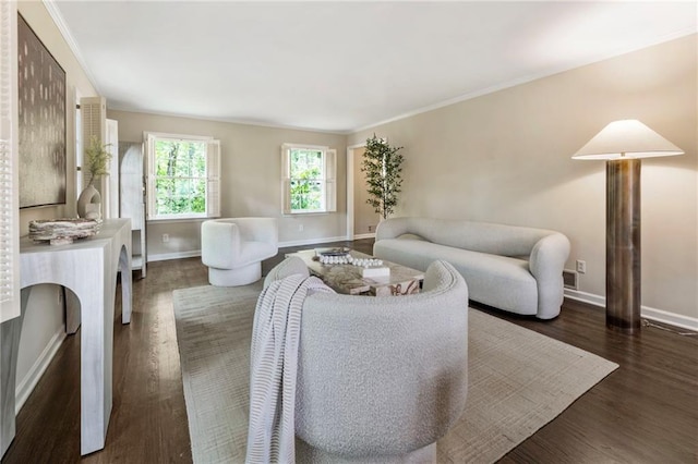 living area featuring baseboards and dark wood finished floors