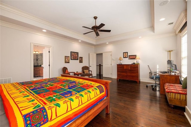 bedroom featuring crown molding, a tray ceiling, dark wood-style flooring, and recessed lighting