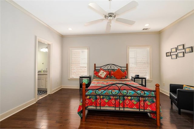 bedroom with dark wood-style flooring, visible vents, crown molding, and baseboards