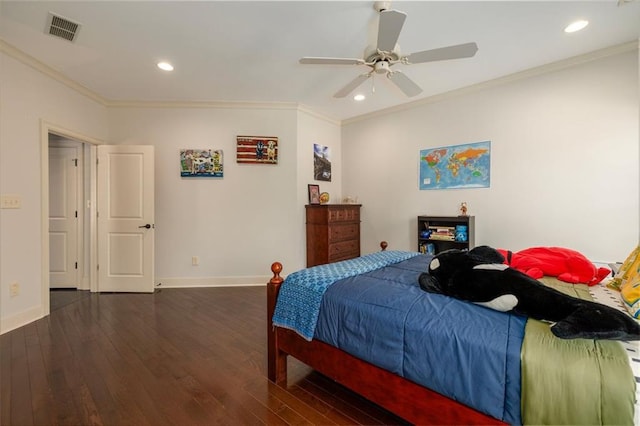 bedroom with baseboards, dark wood-type flooring, visible vents, and crown molding