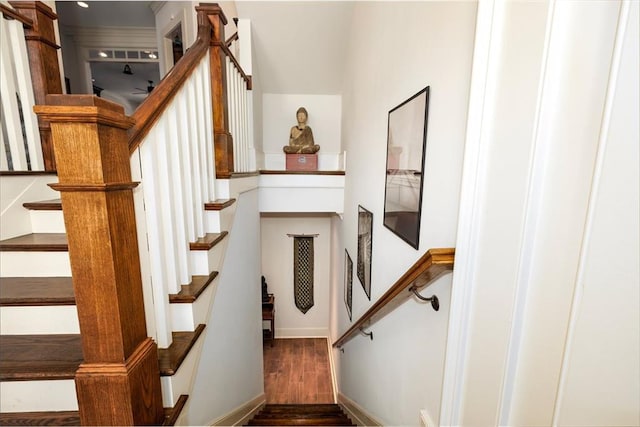 stairway featuring wood finished floors