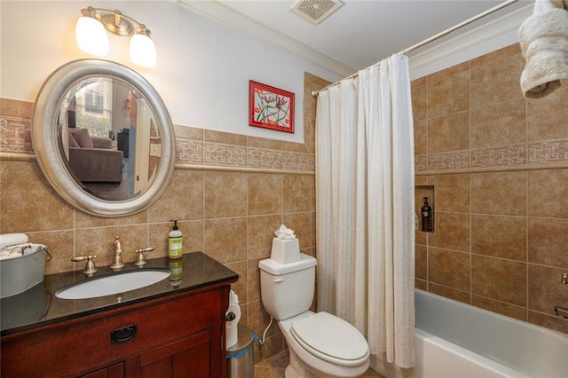 bathroom with toilet, shower / bath combo with shower curtain, visible vents, and tile walls