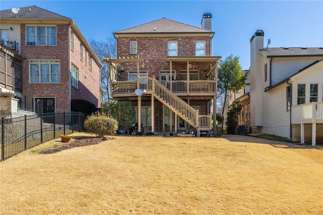 rear view of house featuring central AC, brick siding, fence, stairway, and a chimney