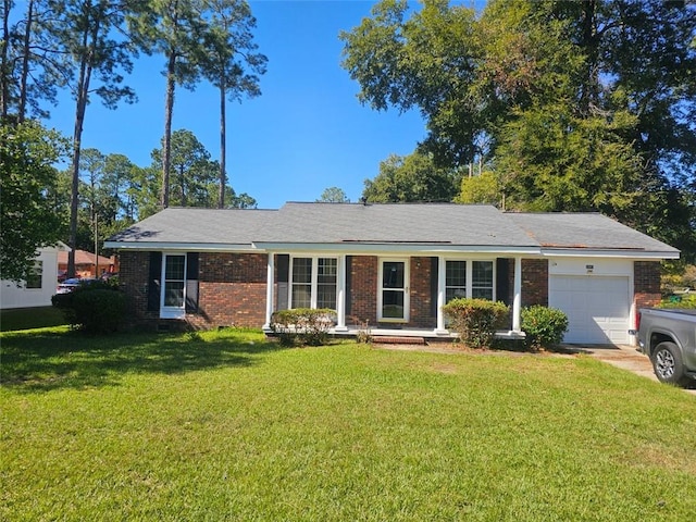 ranch-style home featuring a front lawn and a garage