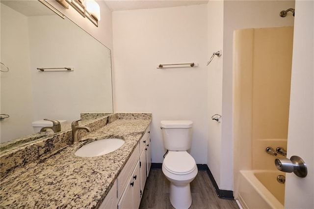 382 Plantation Blvd, Lawrenceville, GA 30046 - full bath with toilet, wood finished floors, vanity, baseboards, and shower / tub combination