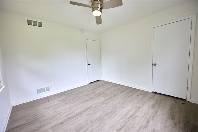 382 Plantation Blvd, Lawrenceville, GA 30046 - unfurnished bedroom with wood finished floors, baseboards, and ceiling fan