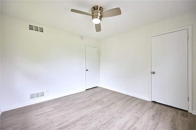 382 Plantation Blvd, Lawrenceville, GA 30046 - unfurnished bedroom featuring wood finished floors, baseboards, and a ceiling fan