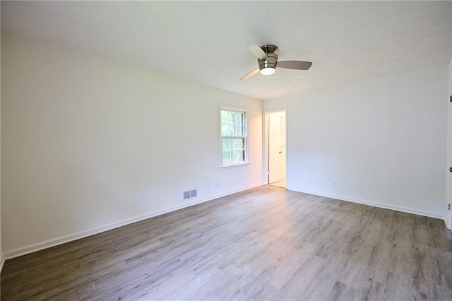 382 Plantation Blvd, Lawrenceville, GA 30046 - spare room featuring wood finished floors, ceiling fan, and baseboards