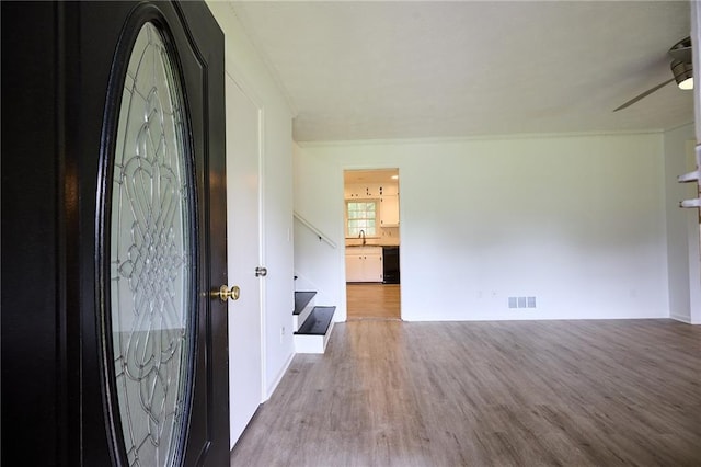 382 Plantation Blvd, Lawrenceville, GA 30046 - foyer featuring wood finished floors, ceiling fan, and stairway