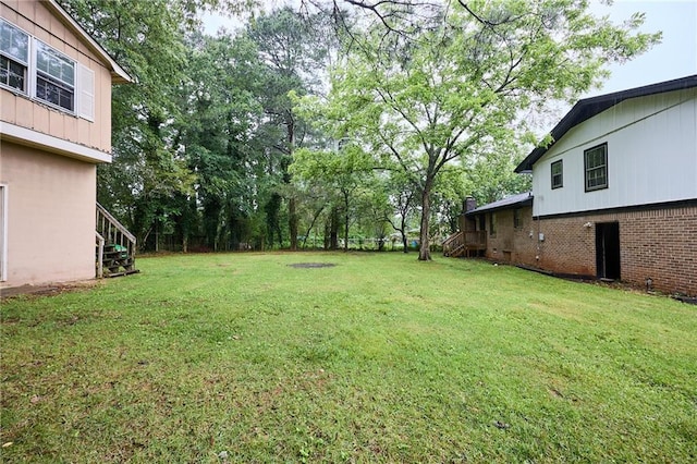 382 Plantation Blvd, Lawrenceville, GA 30046 - view of grassy yard with stairs and view of wooded area