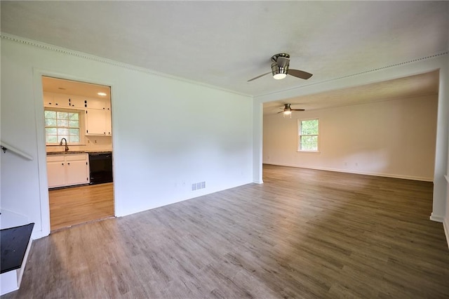 382 Plantation Blvd, Lawrenceville, GA 30046 - empty room with a sink, wood finished floors, ceiling fan, crown molding, and baseboards