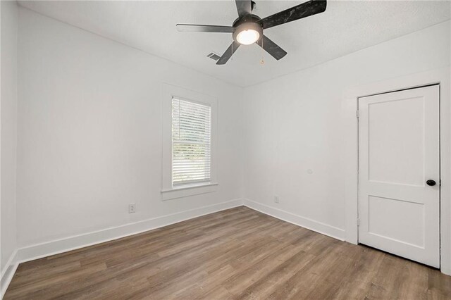 unfurnished room with ceiling fan and light hardwood / wood-style flooring