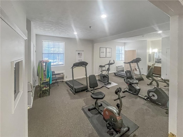 exercise area featuring recessed lighting and baseboards