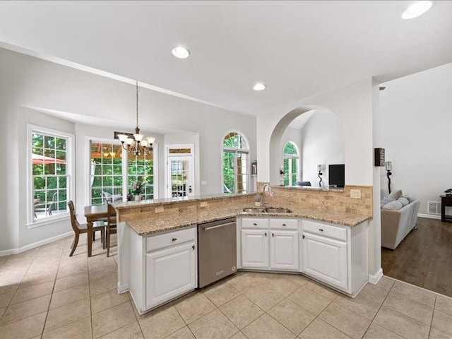 1630 Reindeer Rdg, Alpharetta, GA 30005 - kitchen with dishwasher, a chandelier, white cabinetry, light stone countertops, and light tile patterned floors