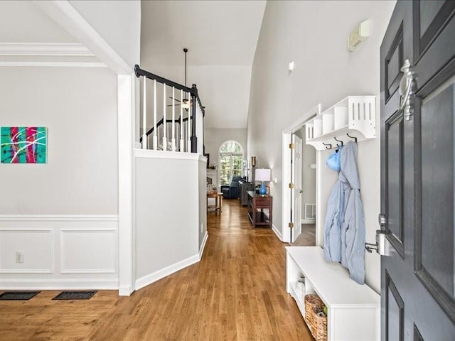 1630 Reindeer Rdg, Alpharetta, GA 30005 - foyer entrance with light wood finished floors, a towering ceiling, and stairs