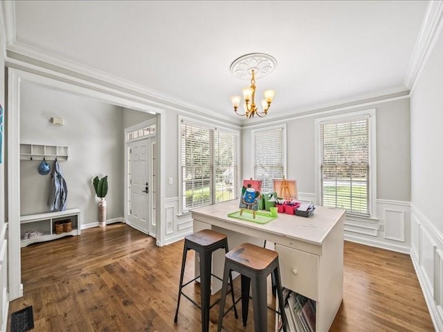 1630 Reindeer Rdg, Alpharetta, GA 30005 - dining area featuring a chandelier, crown molding, a decorative wall, wainscoting, and dark wood-style floors