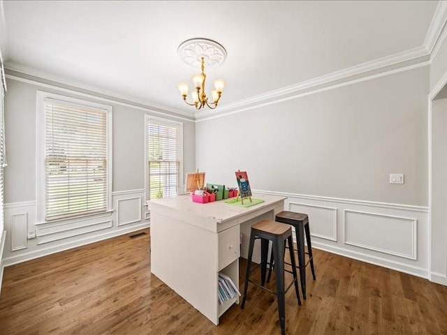 1630 Reindeer Rdg, Alpharetta, GA 30005 - dining space featuring a chandelier, crown molding, wainscoting, dark wood finished floors, and a decorative wall