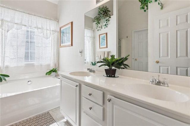 full bath with double vanity, a sink, and a bath