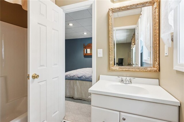 bathroom featuring vanity, ensuite bath, tile patterned floors, a paneled ceiling, and recessed lighting