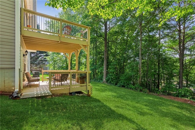 view of yard featuring a wooden deck