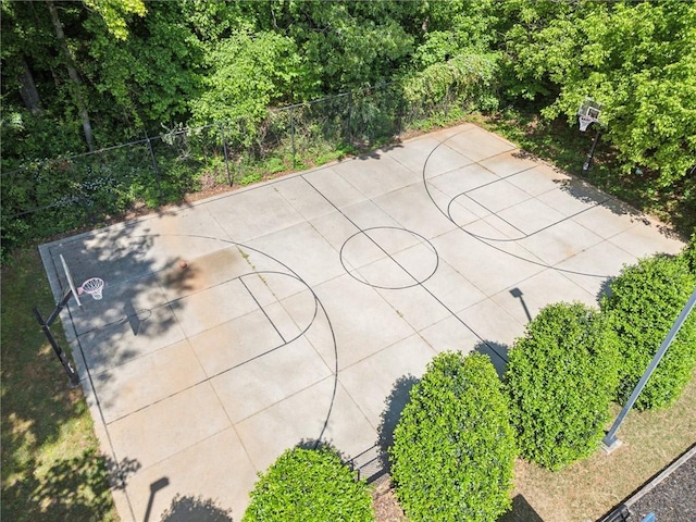 view of sport court featuring fence and basketball court