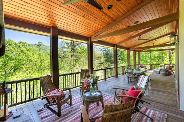 wooden terrace featuring ceiling fan