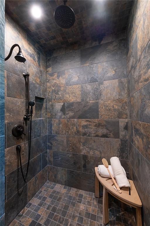 bathroom featuring a tile shower