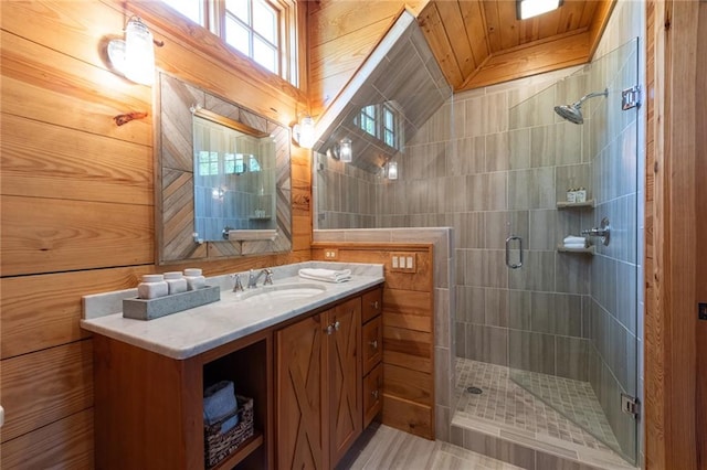 bathroom featuring wooden ceiling, walk in shower, and vanity