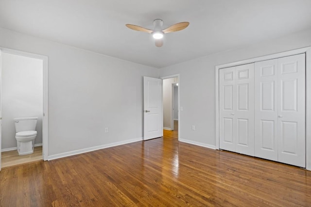 256 Teresa Ln, Loganville, GA 30052 - unfurnished bedroom with wood finished floors, baseboards, a closet, and ensuite bathroom