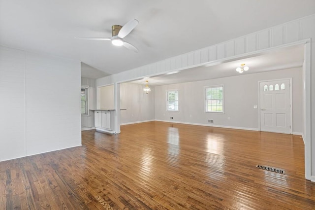 256 Teresa Ln, Loganville, GA 30052 - unfurnished living room featuring wood finished floors, ceiling fan, and baseboards