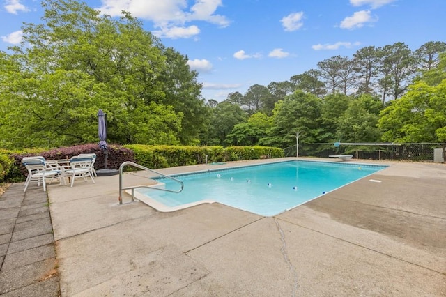 256 Teresa Ln, Loganville, GA 30052 - view of swimming pool featuring a patio area and a diving board
