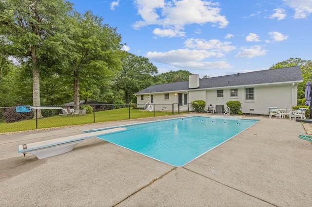 256 Teresa Ln, Loganville, GA 30052 - view of swimming pool with a diving board, a patio, and view of scattered trees